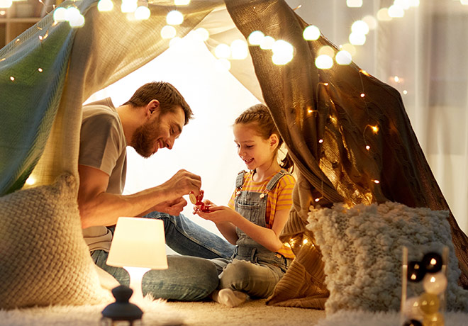 Dad and daughter enjoying time in cosy home